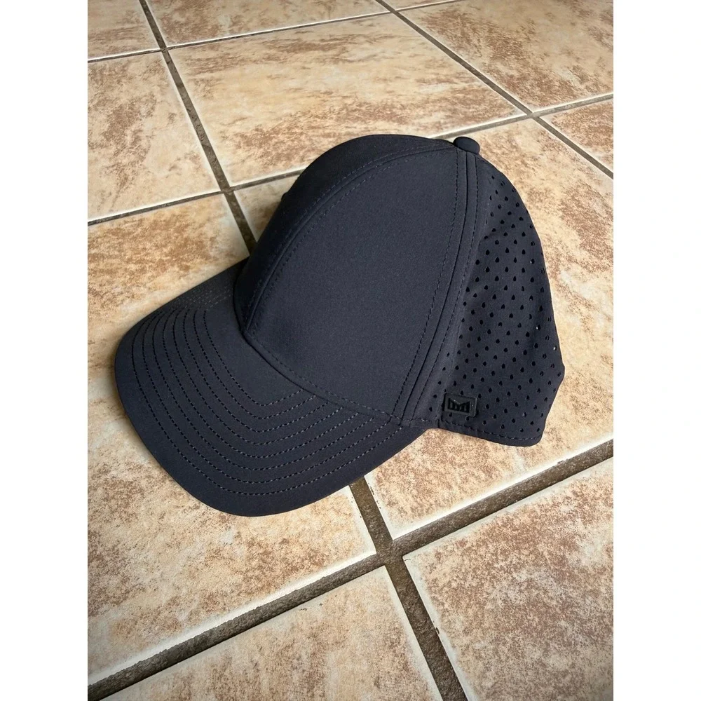 Melin A-Game Hydro Black Performance Snapback Hat 60cm L/XL Water Resistant